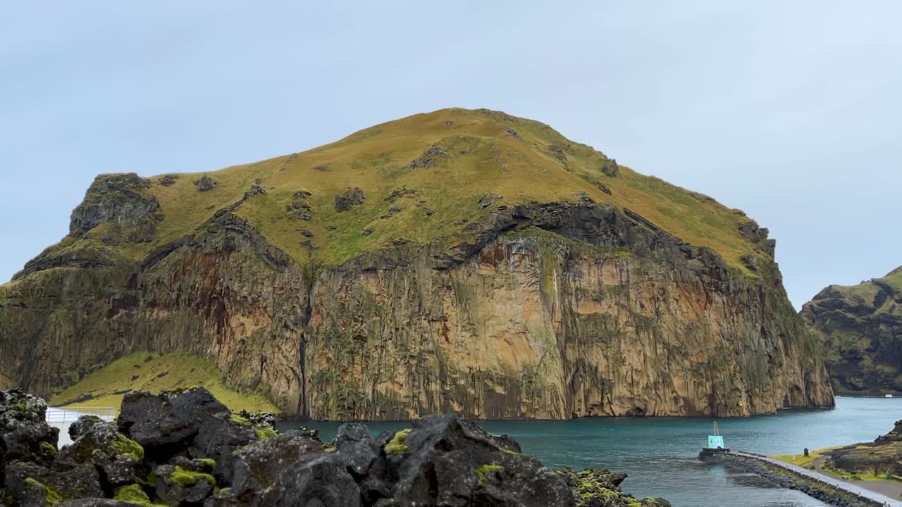 Massive Coastal Rock Steep Cliffs At Vestmannaeyjar (Westman Islands) In Iceland. Static Shot