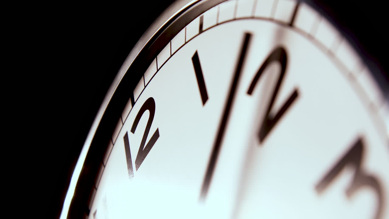 ZOOM OUT, CLOSEUP, ABSTRACT - an unbranded modern clock in timelapse