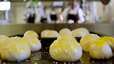 dough ball arranged on tray in kitchen 4k