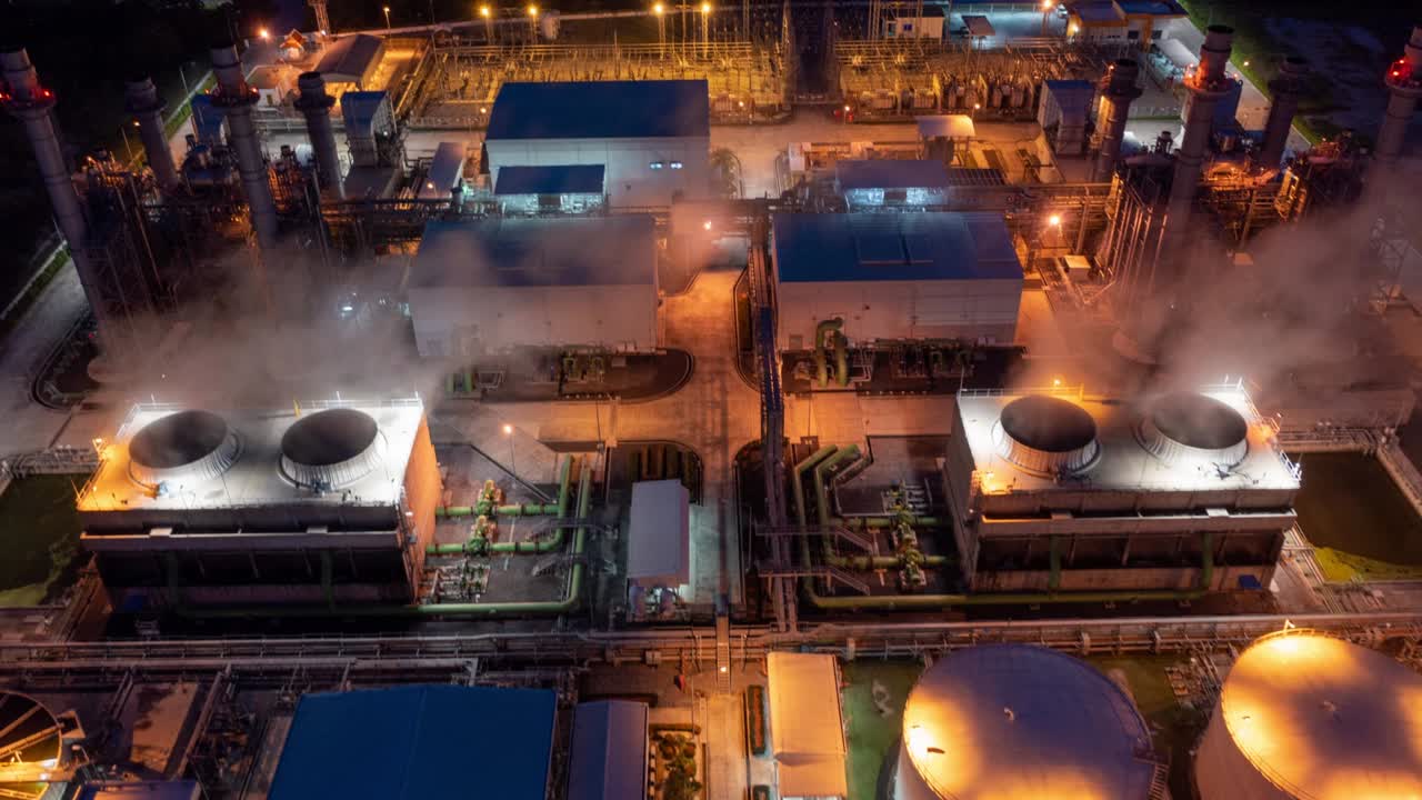 Aerial hyperlapse timelapse of powerplant or fuel gas powerplant at night