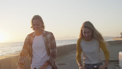 Caucasian-couple-enjoying-their-time-seaside