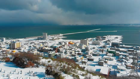 snowy coastal town in japan - aerial view