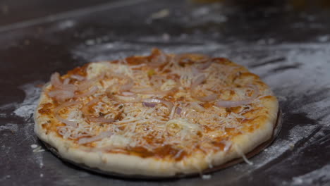 vegetables dropped in pizza base for making pizza