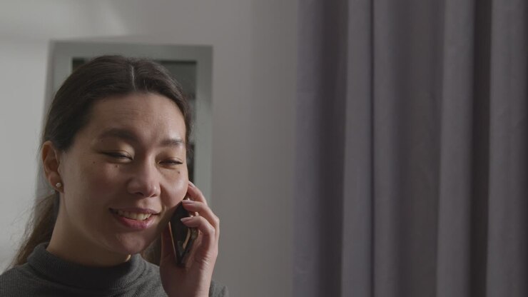 Pleased Young Woman At Home Receiving Phone Call Confirming Job Offer 1