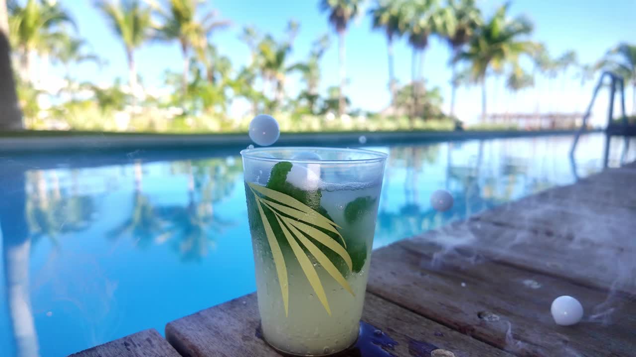 Smoke Bubble falling on a cold drink by the pool in Cabo San Lucas Mexico.
