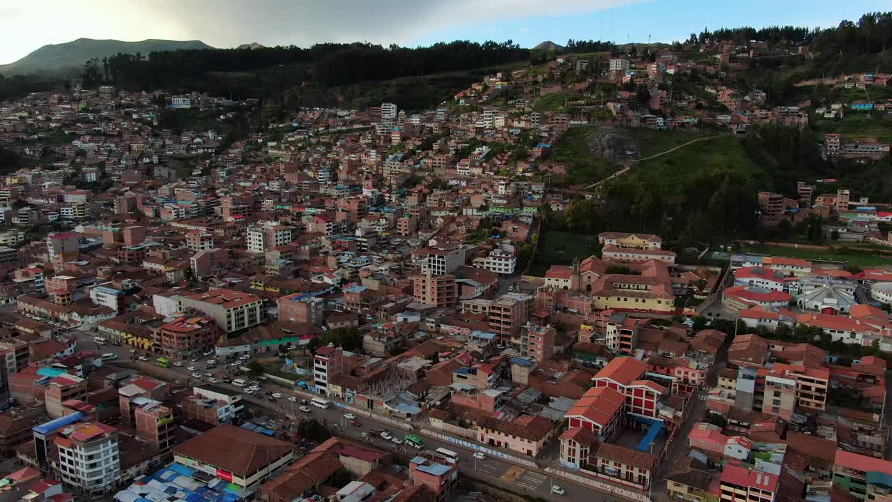 Flying Over Neighborhood In Rosaspata District With Traffic In Cusco, Peru. - aerial