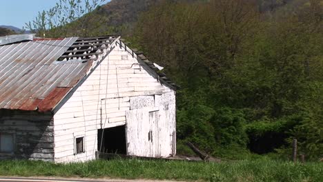 closeup of an old white barn