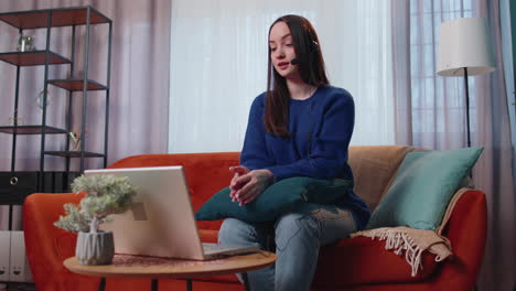 Woman-with-headset-using-laptop,-talking,-working-customer-support-service-operator-at-home-office