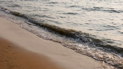 Close-up-of-Ocean-Waves-Along-the-Sandy-Shores-of-Bangsaray-in-Pattaya,-Thailand