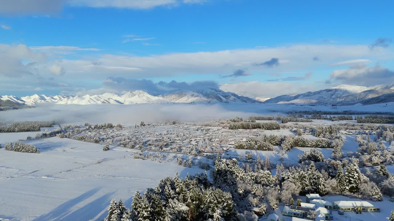 Hanmer Springs alpine town covered by snow. Tourism in New Zealand. Aerial