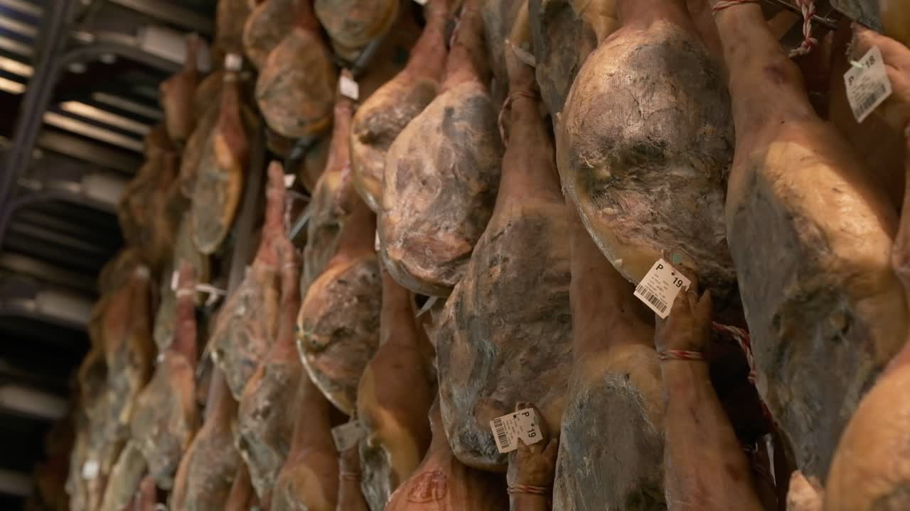 Jamon serrano pig legs factory hanging in a industry. Iberian ham elaboration process