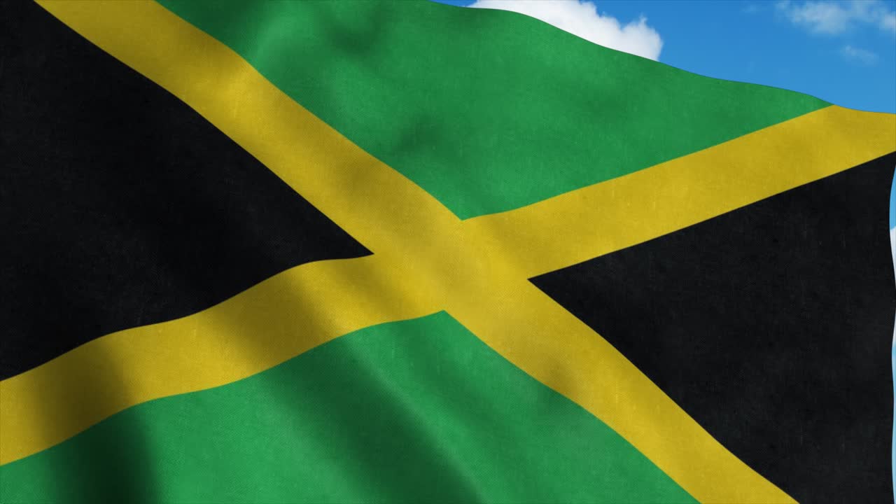 Jamaica flag waving in the wind, blue sky background. 4K