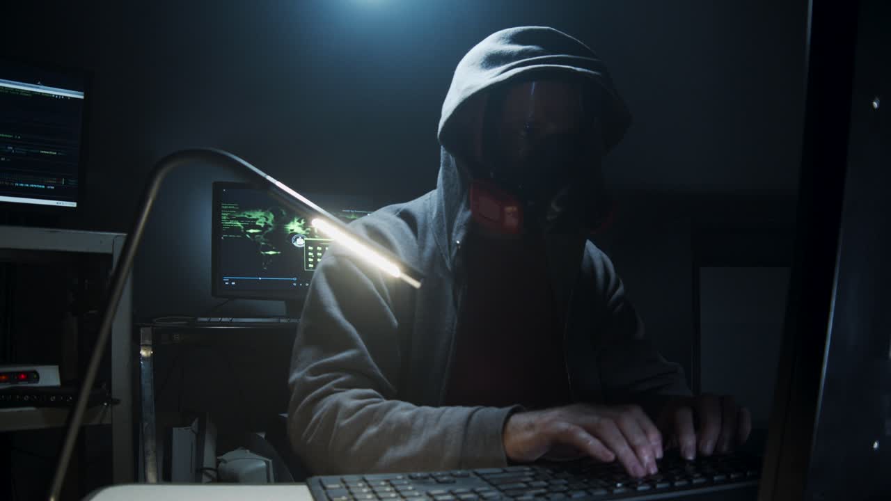 Bio-Terrorist types in computer code wearing a gas mask