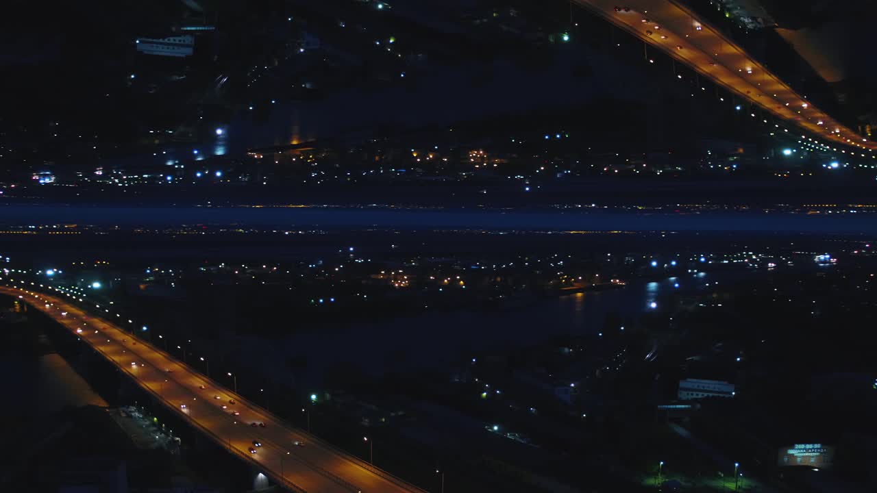 puente nocturno de la ciudad vista aérea