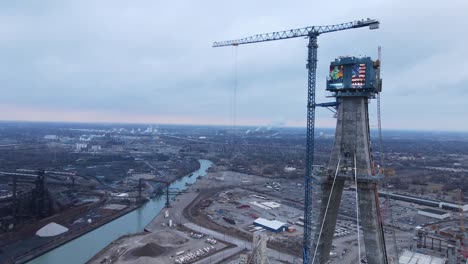 massive concrete structure of gordie howe international bridge, aerial drone view