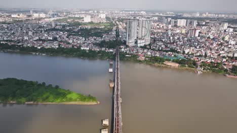 Crossing-over-Long-Bein-bridge,-heading-towards-skyscrapers,-Hanoi