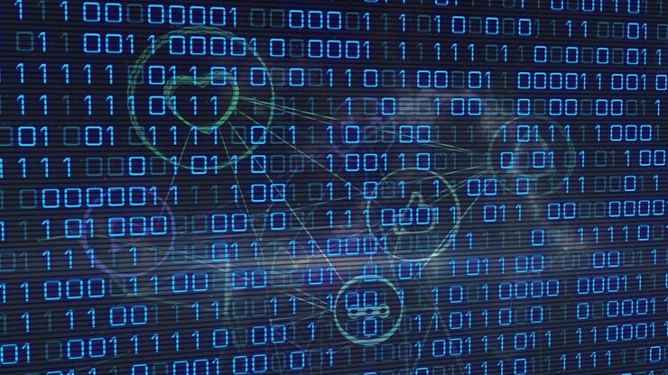 Animation of binary coding over media icons on black background