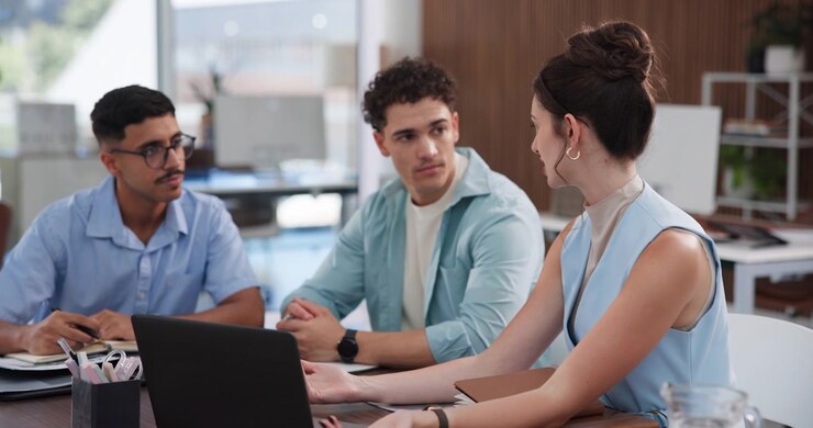 Diverse Team Collaborating on a Project in a Modern Office