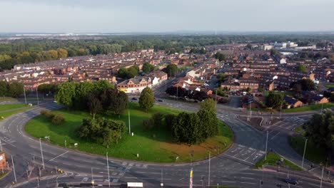 warrington town centre outskirts aerial view above industrial suburban roundabout and houses skyline pan right