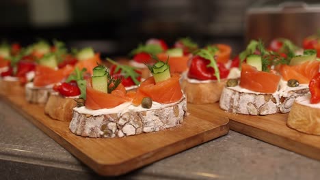 elegant smoked salmon canapés on wooden platters