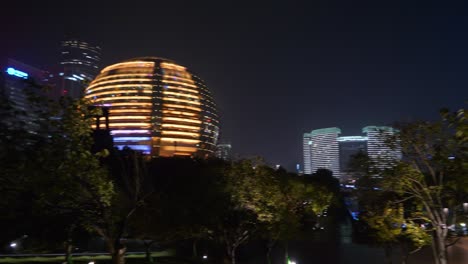 hangzhou city downtown night time illuminated famous modern buildings square panorama 4k china