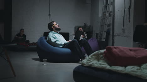 friends gathering in a basement at night