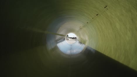 Drone-confined-space-inspection-inside-long-cylinder-resin-coated-industrial-pipe