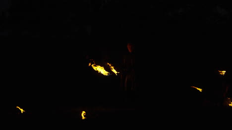 fire performer at night