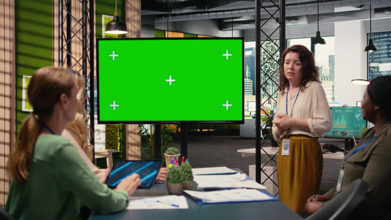 Empowered businesswomen creating synergy with mockup in a boardroom