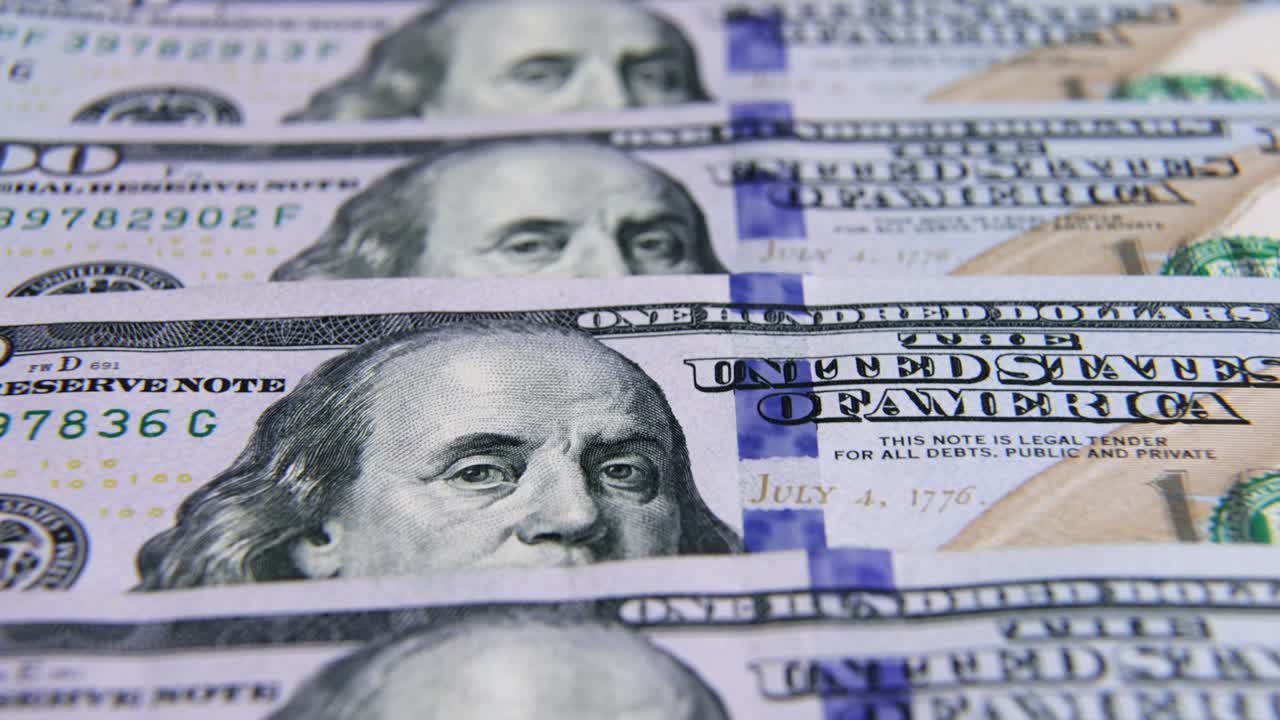 USD Dollar banknotes, paper money, exchange rate currency. Cash banknotes. The concept of finance and investment. hundred US dollars. business economics