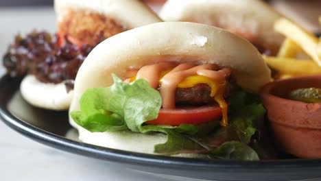 mini bao burgers with fries and pickles