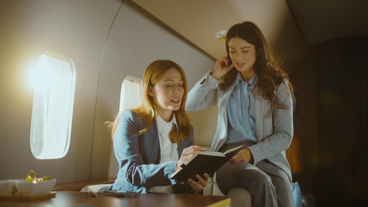 Businesswomen Discussing in Private Jet