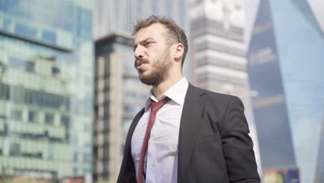 modern businessman in suit is stressed and nervous.