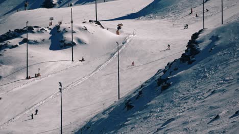 some people skiing on a snowy slope