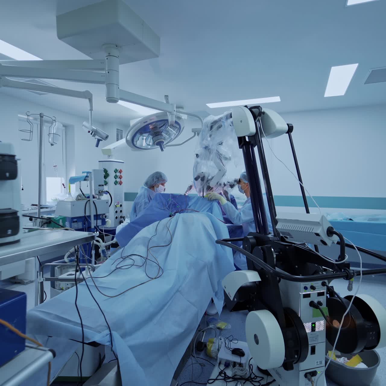 Operation in new neurosurgery room. Group of medical specialists work with modern equipment in the hospital. Medical service.