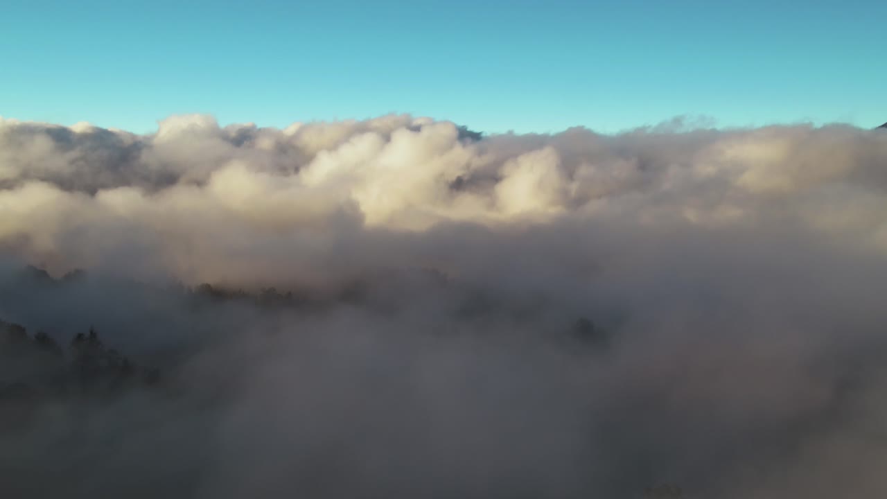 aerial view of Bromo Mountain Located in East Java
flying through the clouds