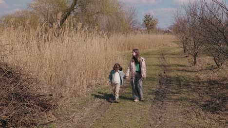 sisters walking in a countryside path