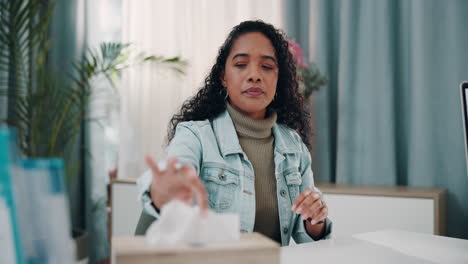 woman sneezing into tissue