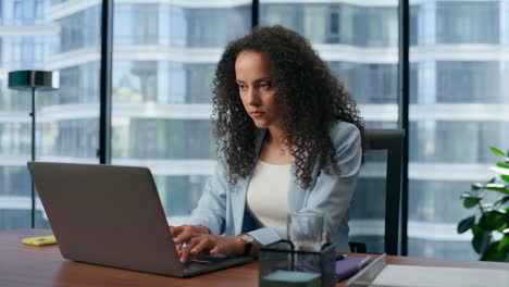 thoughtful business woman working laptop in office. focused ceo making project