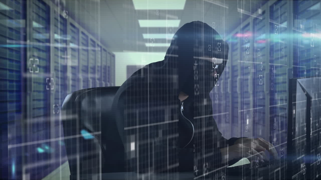 Data processing against male hacker using laptop in server room
