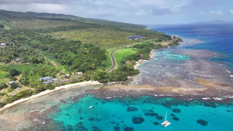 tropical nature with coastal photovoltaic farm on taveuni island, north fiji. aerial drone shot