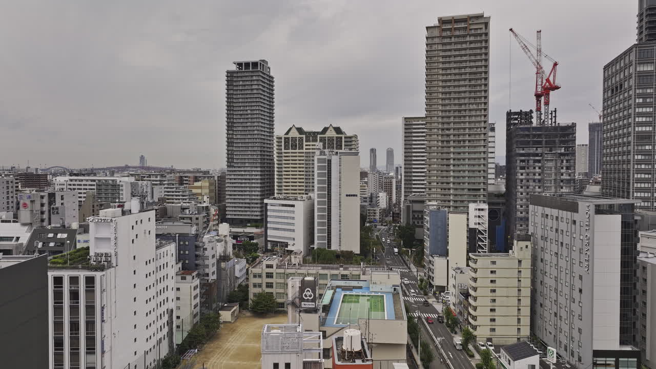 Osaka Japan Aerial v127 drone low flyover Motomachi and Minatomachi capturing densely packed urban cityscape of Naniwa and Nishi ward under an overcast sky - Shot with Mavic 3 Pro Cine - Oct 10th 2023