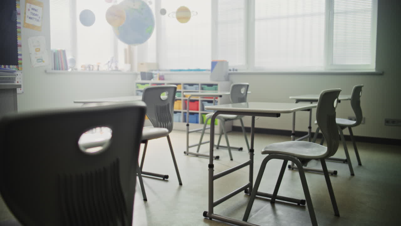 Interior of Modern Empty Elementary School Classroom with Desks for Students