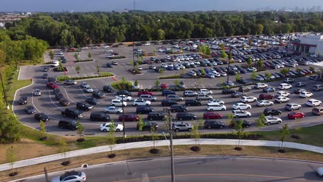 aerial of cars lined up at gas station during fuel shortage while people pump gasoline