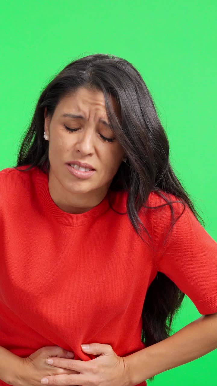 Woman Suffering from Stomach Ache and Nausea on Green Screen