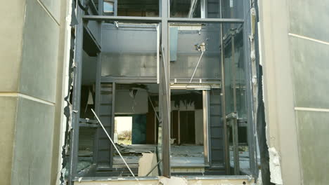 Destroyed-elevator-shaft-in-the-abandoned-hotel,-Tilt-up