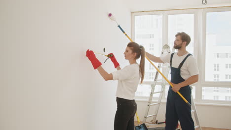 couple renovating a wall