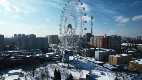 snowy cityscape with ferris wheel