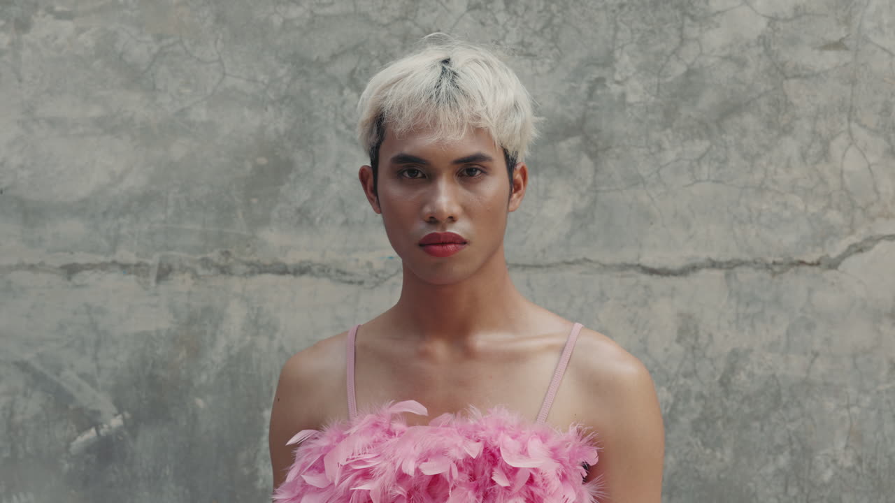 Transgender Man in Pink Feather Dress