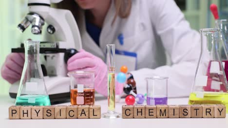 physical chemistry lab experiment with microscope and equipment